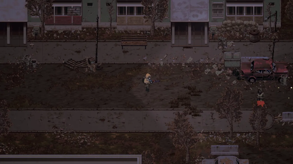 Scavland player character walking a dirt road through a ruined town street — apartment blocks, a wrecked car, and scattered debris — official in-game screenshot